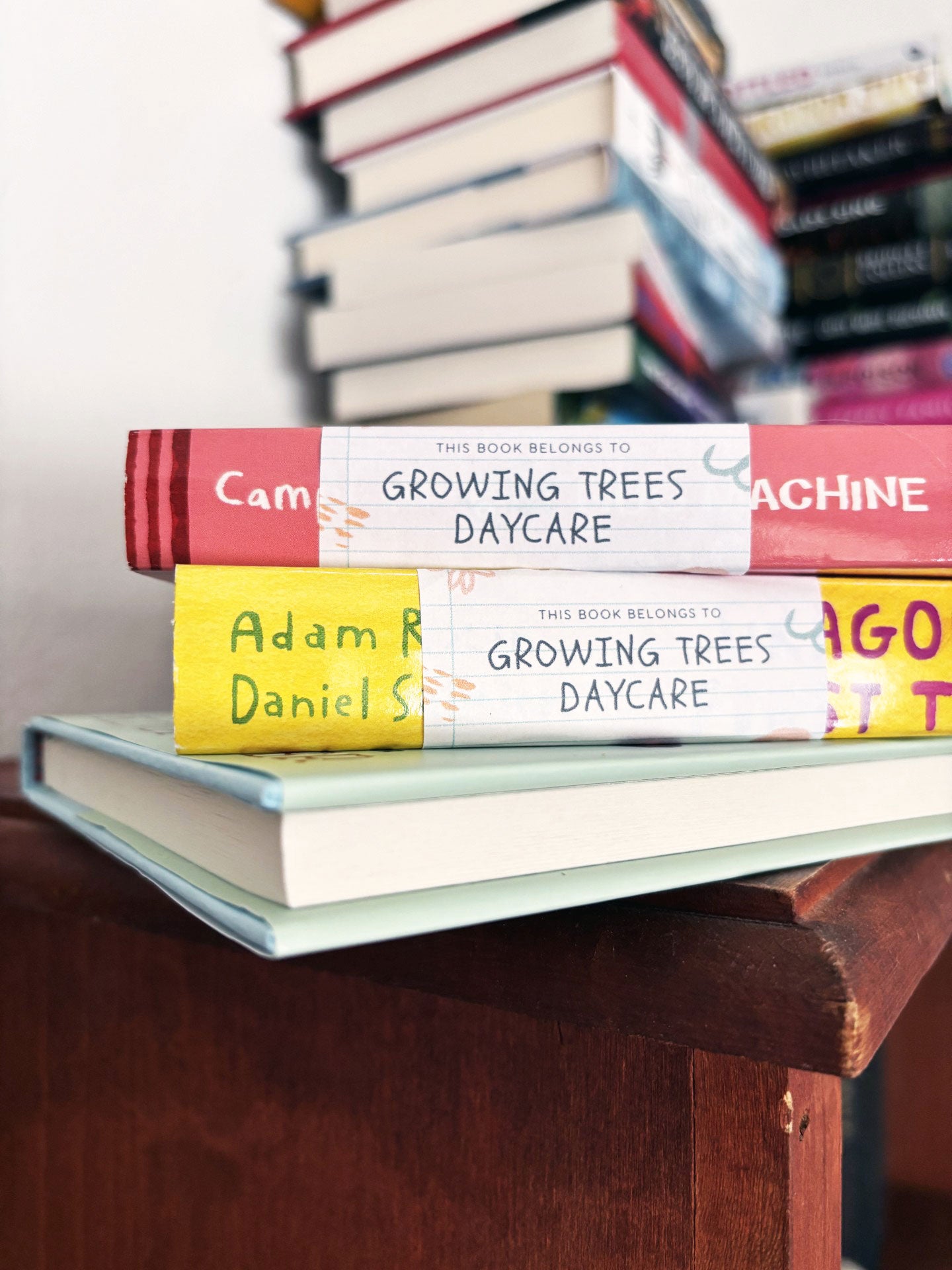Return address label with custom artwork and text that reads "This book belongs to Growing Trees Daycare".
