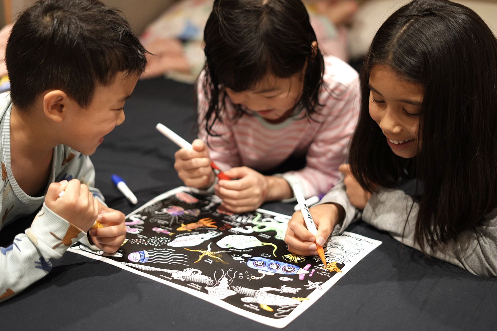 Glow-in-the-Deep Reusable Silicone Coloring Placemat by HeyDoodle