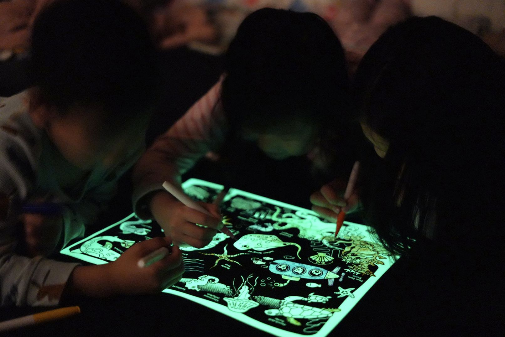 Glow-in-the-Deep Reusable Silicone Coloring Placemat by HeyDoodle