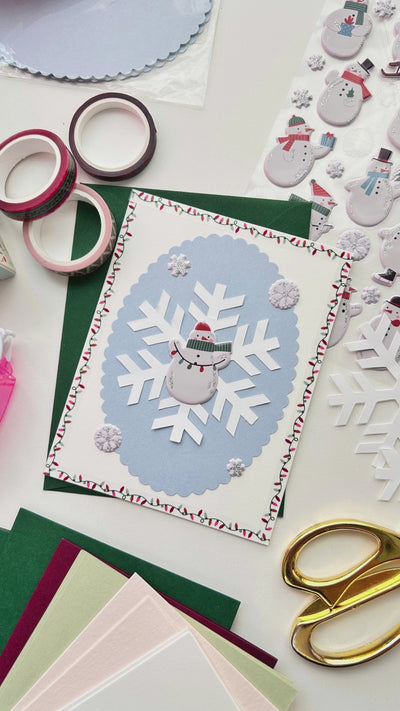 Learn how to create a DIY snowman sticker greeting card.