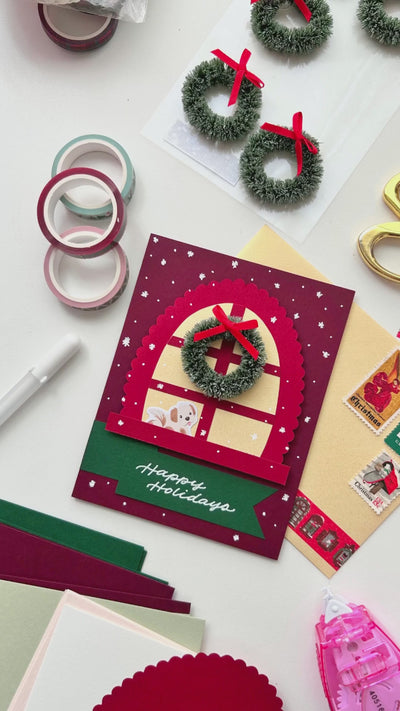 DIY video of how to craft a holiday window greeting card.