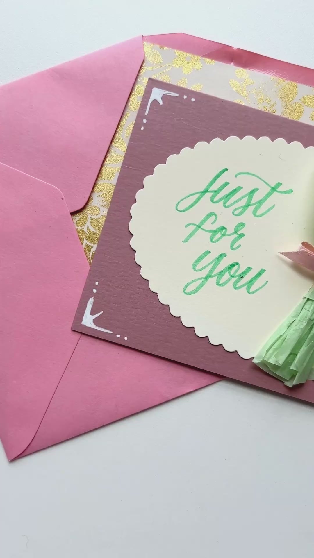 Video detailing how to create a handmade card with felt floral stickers.