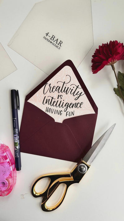 Hand lettering on an envelope liner video.