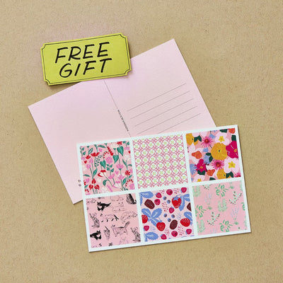 Free gift with $35 in store purchase animation displaying rotating colorful post cards.