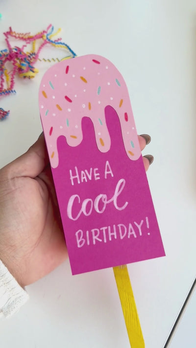 Video displaying how to create a DIY popsicle gift card box.