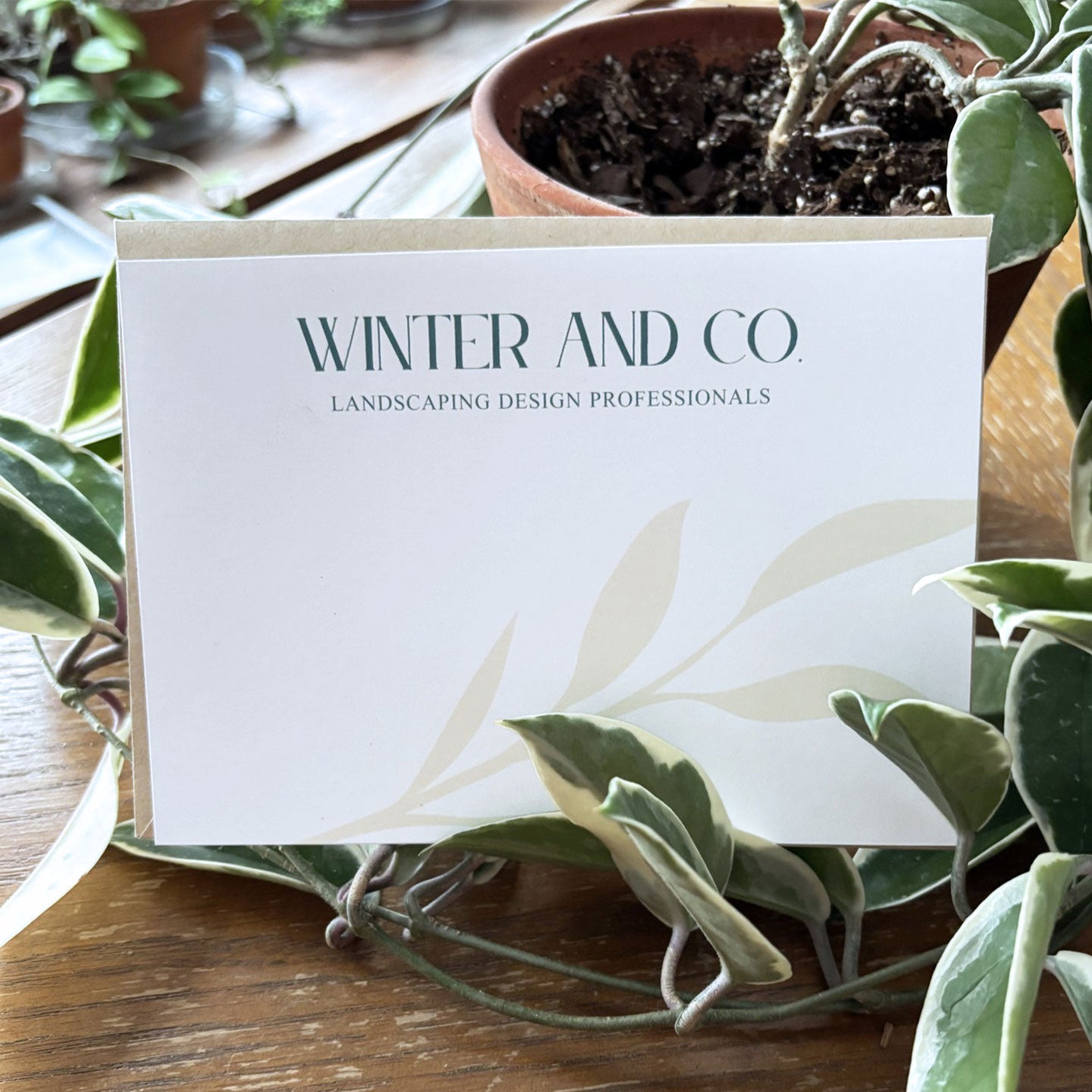 Custom stationery design with artwork that reads, Winter And Co. Landscaping Design Professionals.