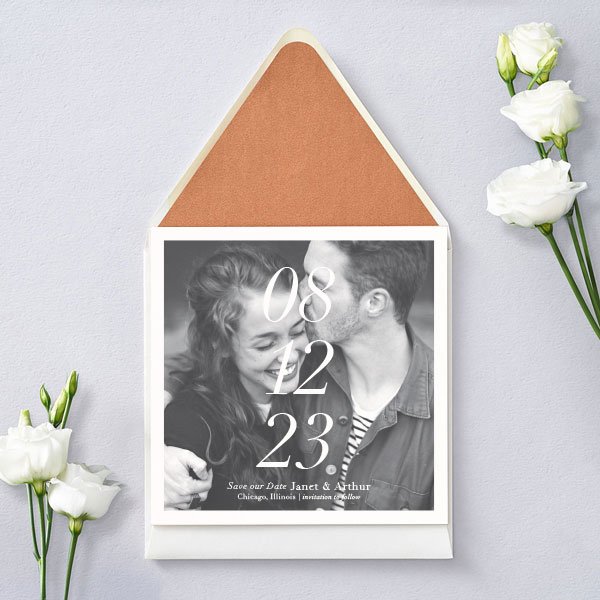 Modern save the date announcement with bold stacked date and prominent photo.