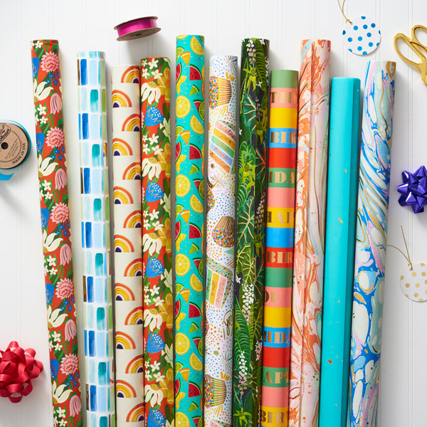 Wrapping paper rolls in colorful and unique designs.
