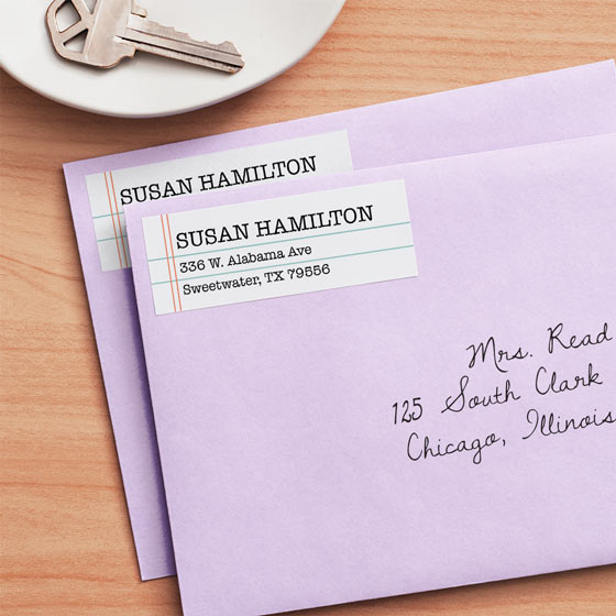 Lined paper customizable address label adhered to a plum envelope.