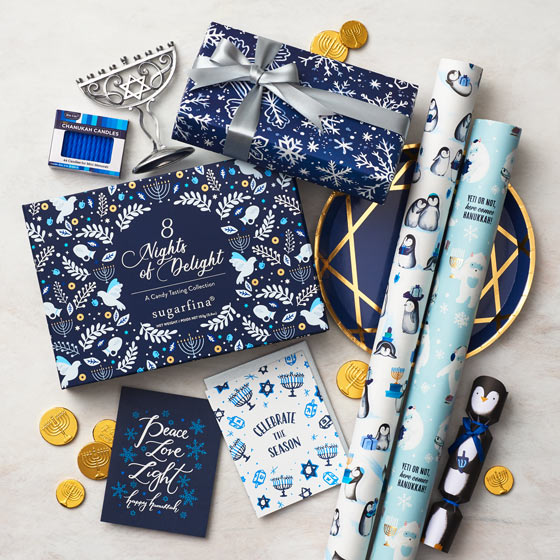 An assortment of Hanukkah gift wrap, greeting cards and party decor.